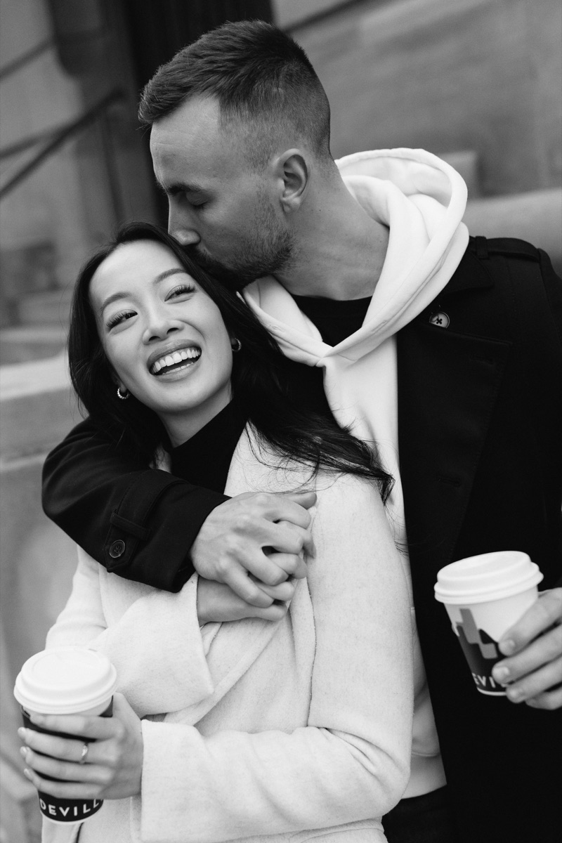 Kai kissing Alvina’s forehead as they smile together with coffee