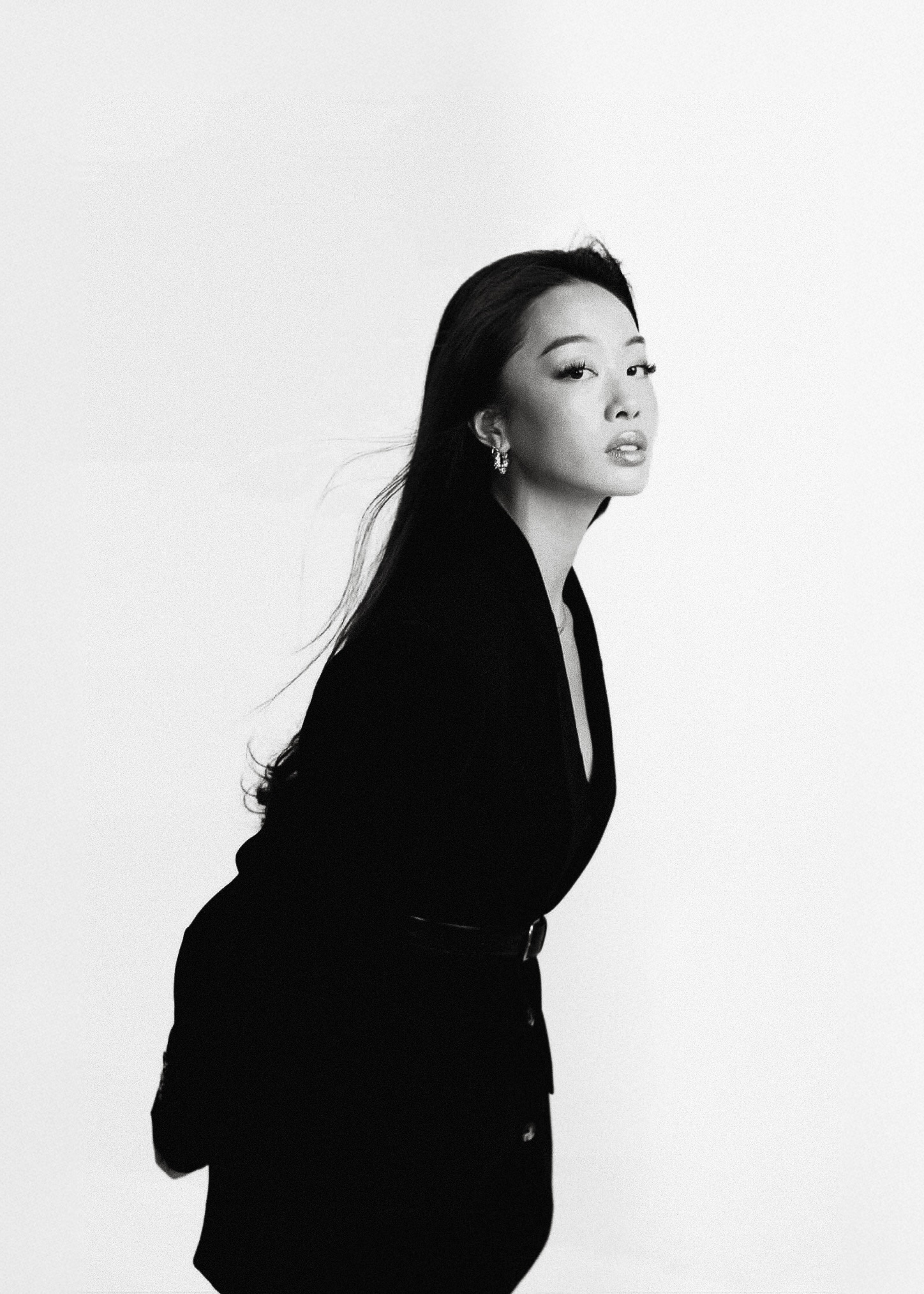 Black-and-white portrait of Alvina in a black jacket
