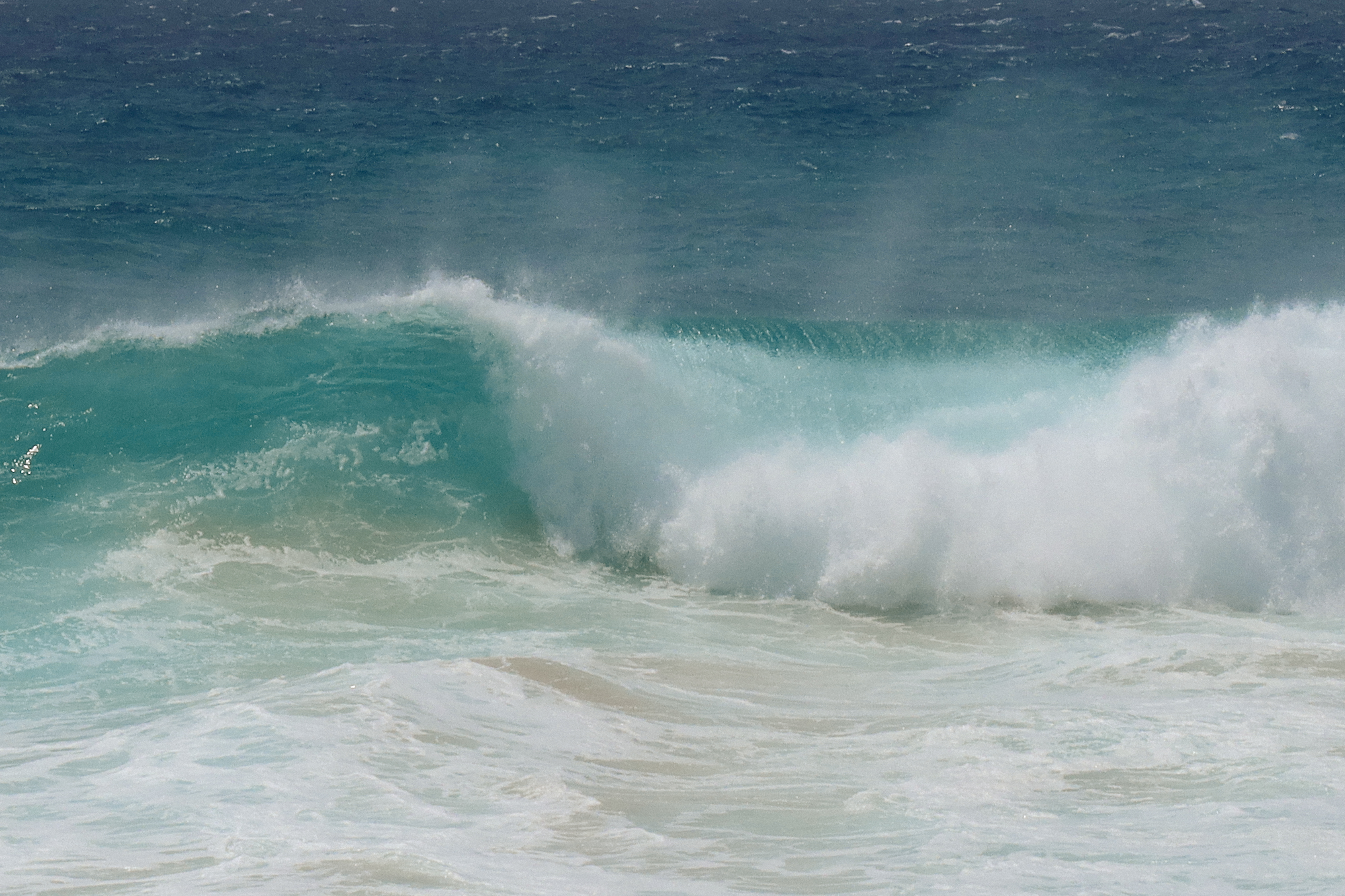 Waves breaking on the shore