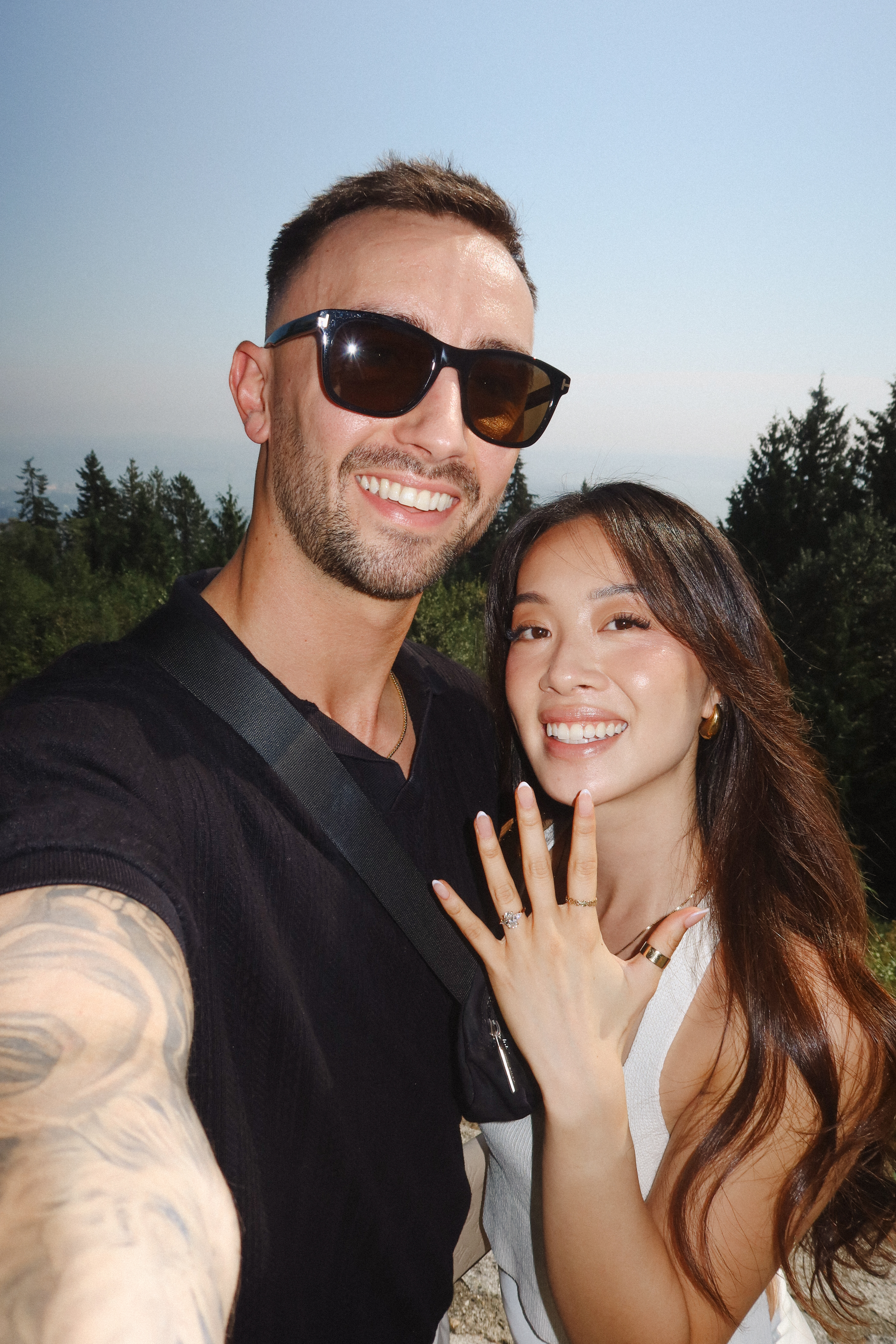 Alvina and Kai smiling together with Alvina’s engagement ring